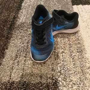 Blue and Black Nike shoes.